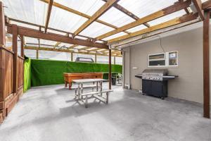 an empty garage with a ping pong table in it at FlyingPig Backpacker Rotorua in Rotorua