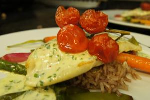 a plate of food with eggs and vegetables and rice at La Clavelière in Saint-Auban-sur-Ouvèze