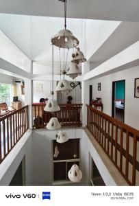 a living room with a bunch of chandeliers at Vagamon Hill Chimes in Vagamon