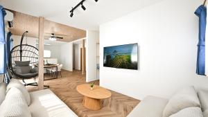 a living room with a couch and a table at LAZULI Fukutsu in Fukuoka