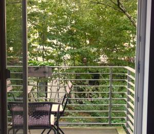 a porch with a bench and a fence at Architektenwohnung in der Sternschanze in Hamburg