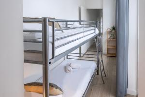 a couple of bunk beds in a room at Spacious Family Stay Eindhoven, Garden & Kitchen in Eindhoven