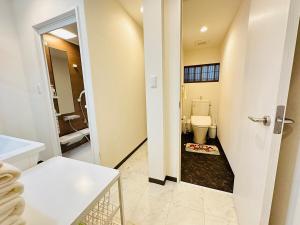 a bathroom with a toilet and a sink at 楽途居 in Osaka +32 photos