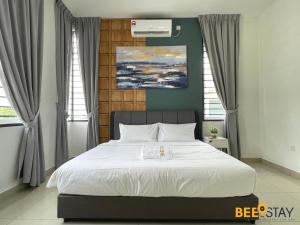 a bedroom with a large bed with white sheets at Desaru Arcadia Double Storey House 11-16 Pax 5 Mins to Desaru Beach in Bandar Penawar +80 photos