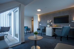 TV a/nebo společenská místnost v ubytování Ebner - Boutique-Hotel & Konditorei