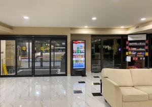 a store lobby with a couch and a store at Comfort Suites Kings Bay Naval Base Area in Kingsland