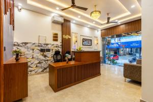 a lobby of a salon with a reception desk at Hotel The King Palace Free Pick up From Nizamuddin Railway Station in New Delhi