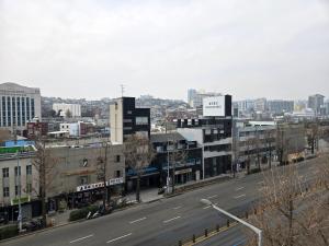 a view of a city with a street and buildings at Quantum Hotel, Seoul Station br in Seoul