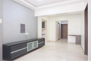 a living room with a black and white wall at Via Shree Haree Residency in Pune