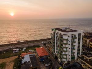 an aerial view of a building next to the ocean at Marine Suites in Colombo
