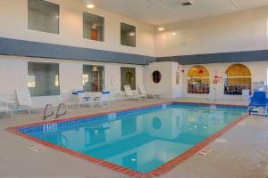 a large pool with blue water in a building at Quality Inn & Suites Roswell North in Roswell