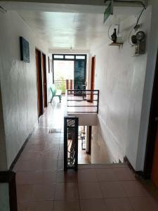 a hallway of a house with a table in it at Constrell Pension House in Tagbilaran City