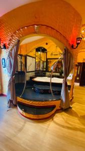 a stage with a bed in a room at PENTHOUSE PATTAYA in Pattaya