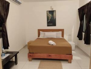 a bedroom with a bed in a room at Hangout at Nandi Hills in Nandigunda