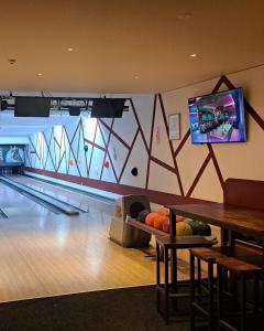 a bowling alley with a ball at Glamping resort Dolenjc in Novo Mesto