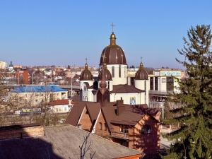 a large building with a domedasteryasteryasteryasteryasteryasteryasteryasteryastery at Центр стадіон Central Сity Замкова in Rivne
