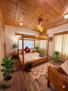 a bedroom with a wooden bed in a room at The Shivdhaar Estate kud'Patnitop in Kūd