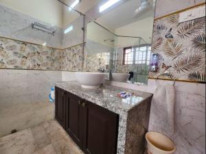 a bathroom with a sink and a mirror at Lukochurri in Shānti Niketan +110 photos