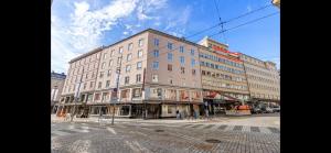 a large building on the corner of a street at Apartment Bergen Central - private balcony in Bergen