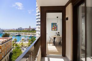 a balcony with a view of a harbor at C36 Elegant 2 bdr apt Amazing Views in Málaga