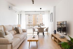 a living room with a couch and a table at C36 Elegant 2 bdr apt Amazing Views in Málaga