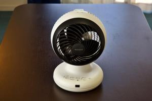 a small white fan sitting on top of a table at はなハウス 401 in Ginowan +68 photos