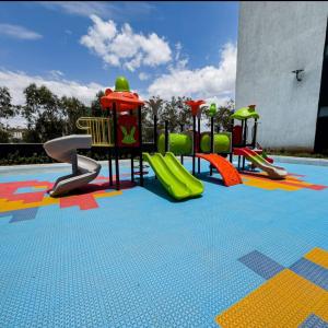 a childrens playground with slides and slidesktop at Ideal homes in Gatunga