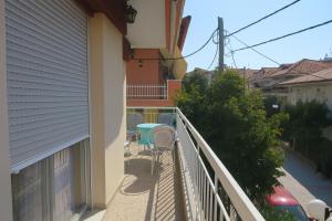 a balcony with a table and chairs on it at Balcony Sea Hanioti Stay in Hanioti +2 photos