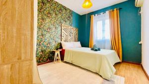 a room with a bed and a window and a table at Modern House with Pool in Grand-Baie