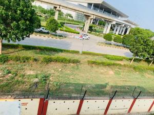 a view of a parking lot with a building at Hotel Mahadev Home-Stay !! Near Chandigarh It'l Airport in Chandigarh Airport +11 photos
