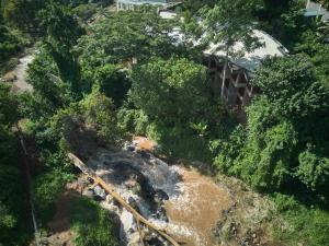 an aerial view of a river in a forest at Villa Rock Stop Falls Gigiri in Nairobi
