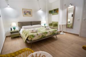 a bedroom with a bed with teddy bears on it at VILLA SEA VIEW IN SICILY, Real Relax in Fontane Bianche