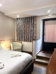a hotel room with a bed and a window at Rifugio AL in Randazzo