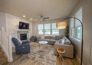a living room with a couch and a fireplace at Hydrangea Hideaway in Ocean Shores