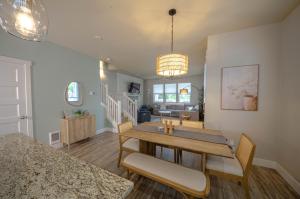 a dining room and living room with a table and chairs at Hydrangea Hideaway in Ocean Shores