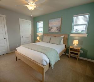 a bedroom with a bed with green walls and a ceiling at Hydrangea Hideaway in Ocean Shores