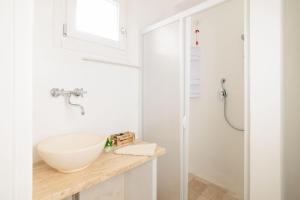 a bathroom with a white bowl sink on a counter at Masseria il Vignale in Ostuni +42 photos
