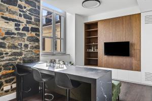 a dining room with a table and two chairs at Appartamento Porta Torre - Porta Torre-Centro in Como +25 photos