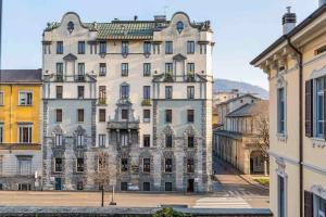 a large building in the middle of a city at Appartamento Porta Torre - Porta Torre-Centro in Como