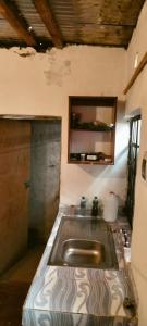 a kitchen with a sink in a room at Yua Residence in Machakos