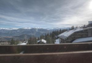 a view of a snow covered mountain with a train at Antares 402 au centre a Anzere in Anzère