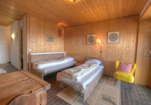 a living room with a couch and a chair at Antares 403 au centre a Anzere in Anzère
