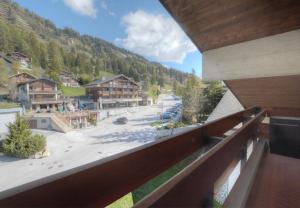 a view from a balcony of a resort at Antares 507, au centre a Anzere in Anzère