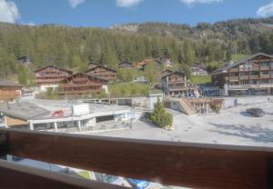 a view from a balcony of a ski resort at Antares 507, au centre a Anzere in Anzère +1 photo