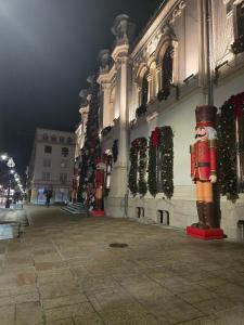 a building with christmas decorations on the side of it at Studio in the center in Craiova