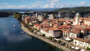 an aerial view of a town next to a river at The Hangar Loft - Leonoardo, Center & Parking in Sesto Calende
