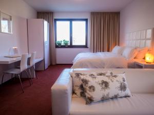 Postel nebo postele na pokoji v ubytování Hotel Cvilín