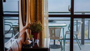 a view of a balcony with a table and chairs at Water Swing B&B in Ren'ai