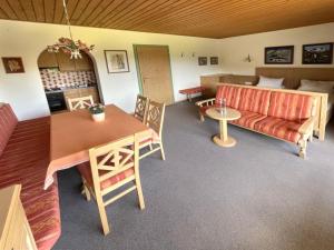a living room with a couch and a table at Chalet Cristall Superior Appartement 6 in Leutasch
