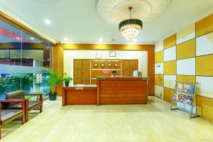 a lobby with a reception desk in a building at Hotel Lals Residency, Adoor in Adūr